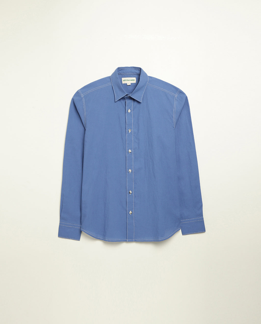 Organic cotton shirt naturally dyed in quiet blue, front view, lightweight