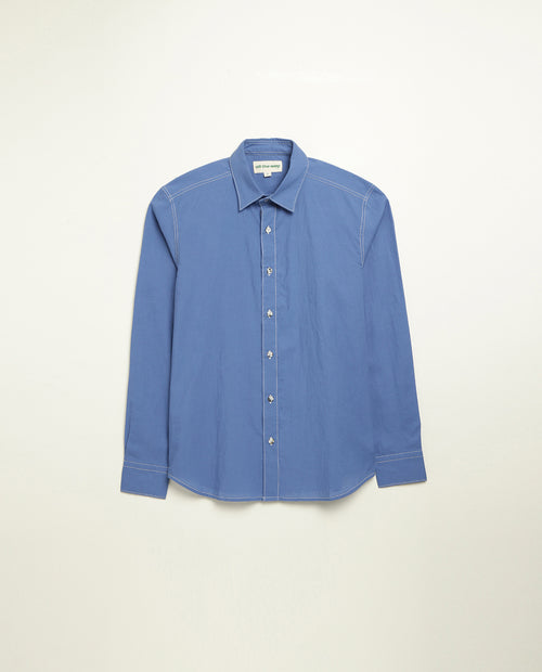 Organic cotton shirt naturally dyed in quiet blue, front view, lightweight