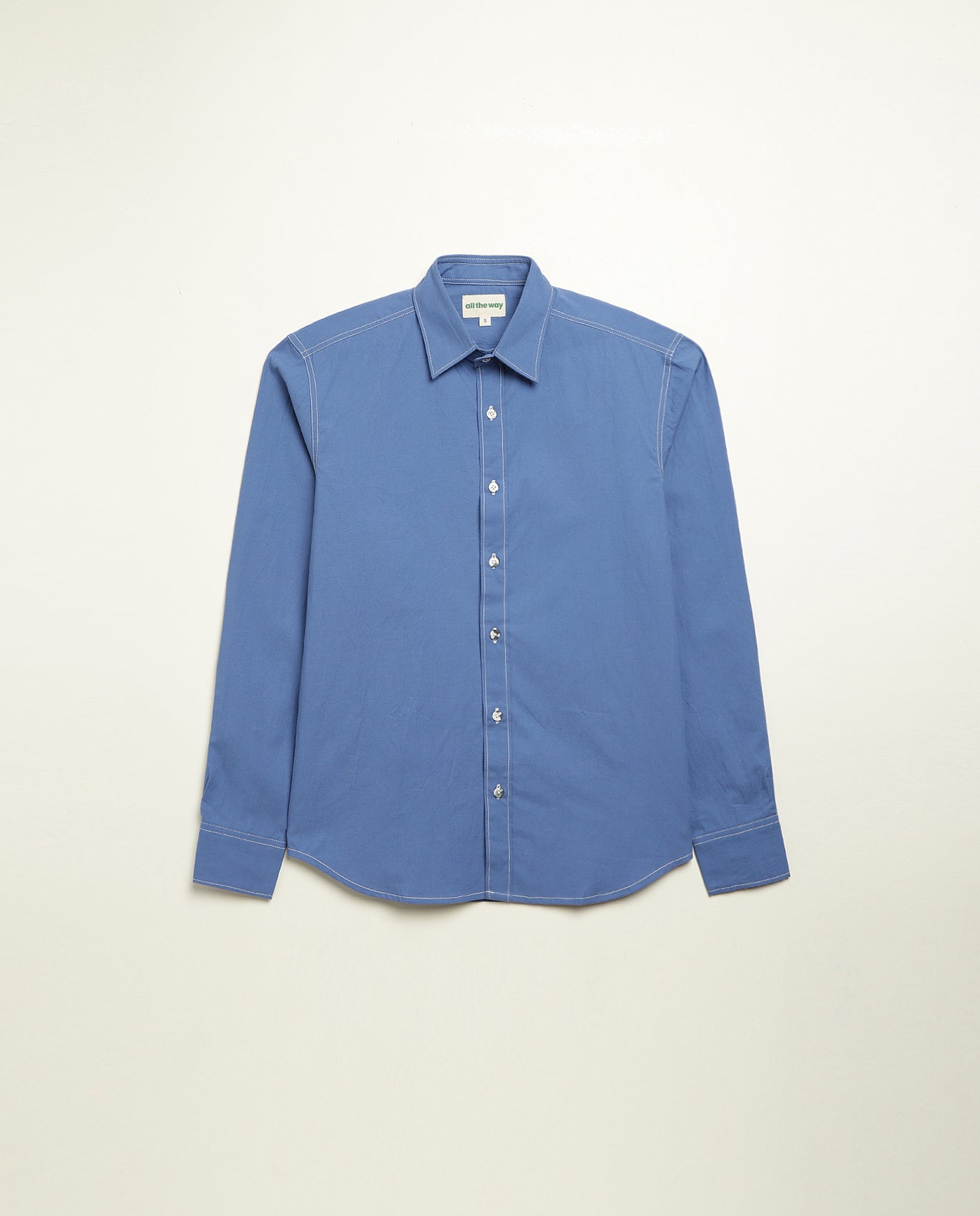 Organic cotton shirt naturally dyed in quiet blue, front view, midweight