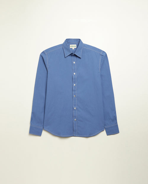 Organic cotton shirt naturally dyed in quiet blue, front view, midweight