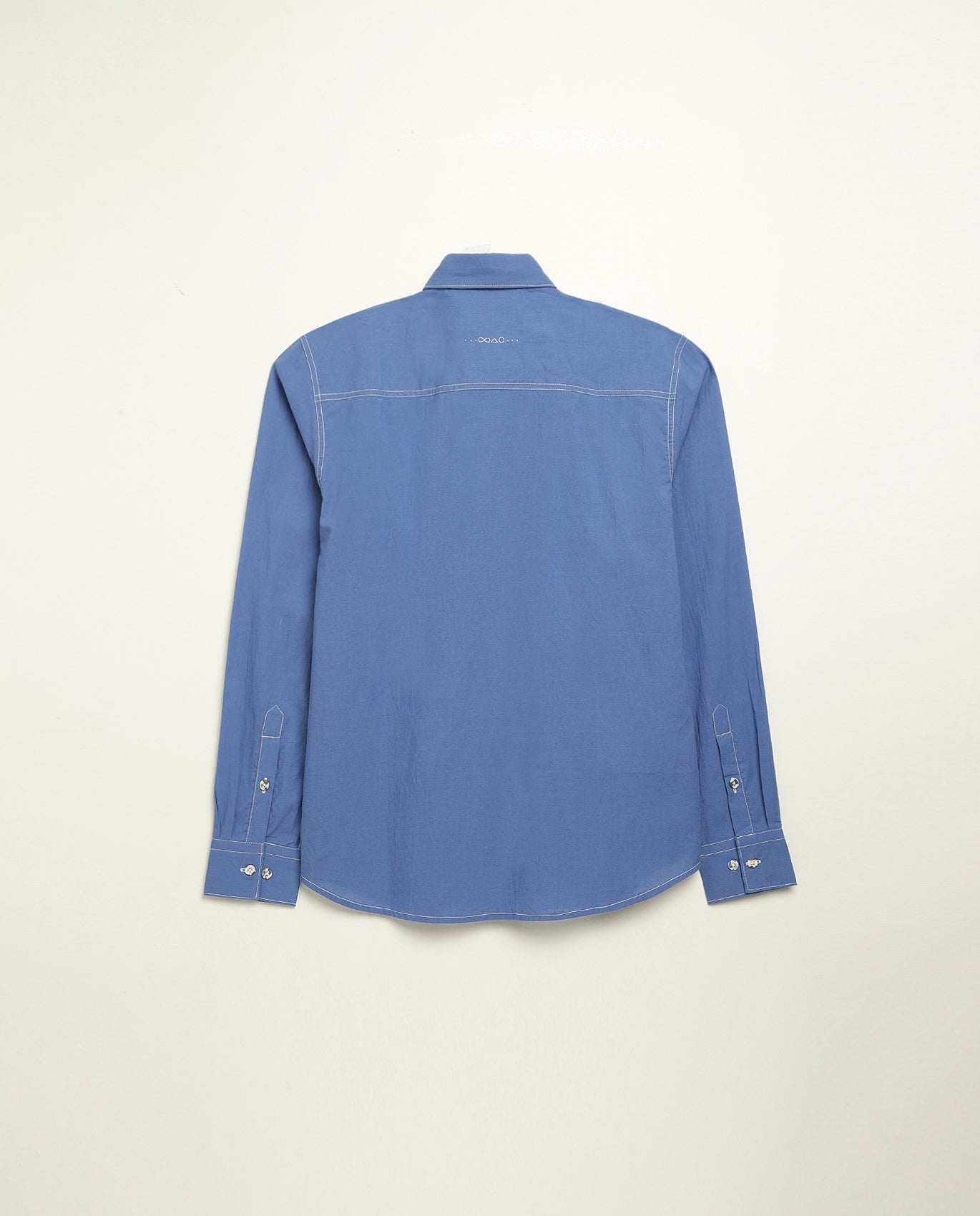 Organic cotton shirt naturally dyed in quiet blue, back view, lightweight