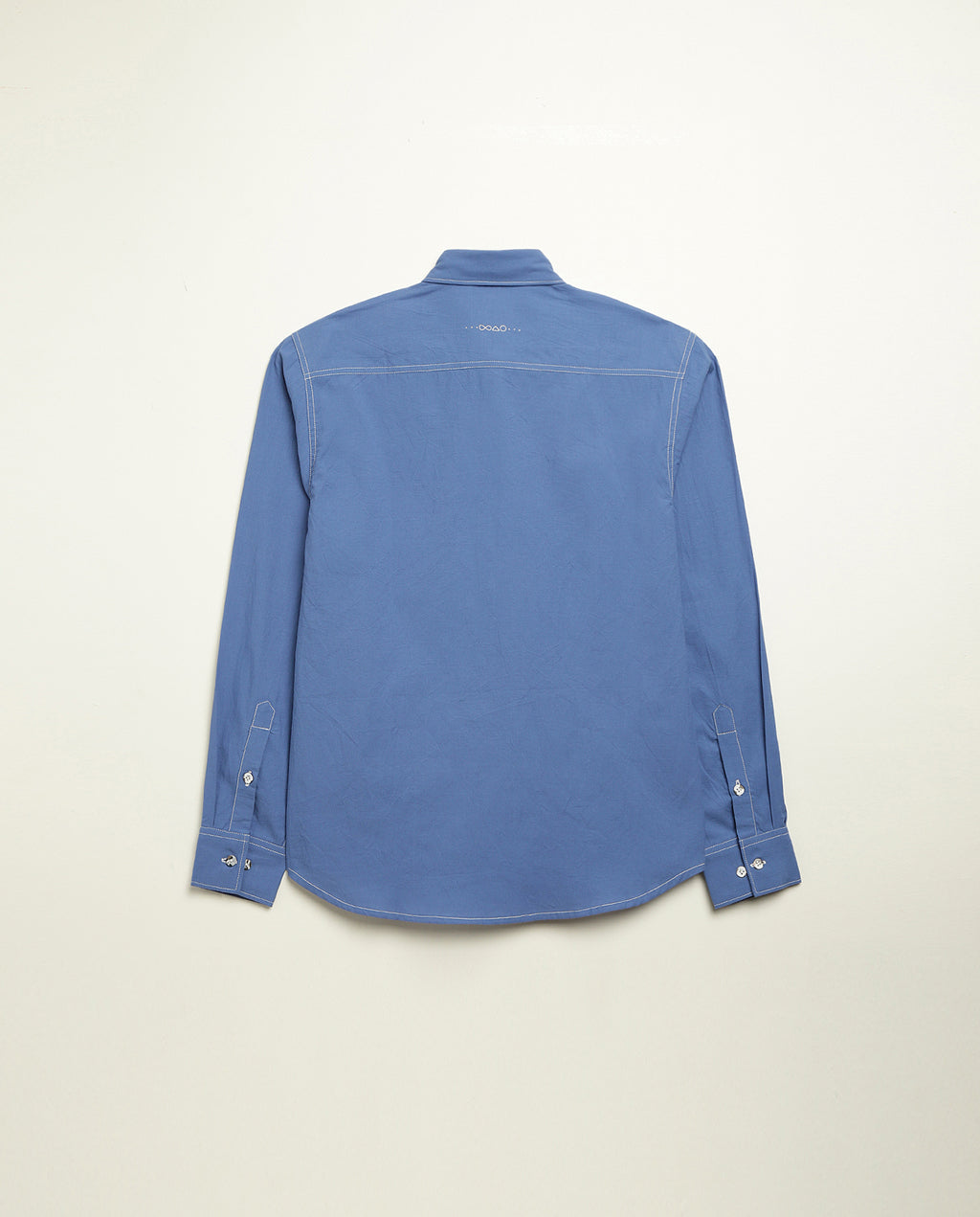 Organic cotton shirt naturally dyed in quiet blue, back view, midweight