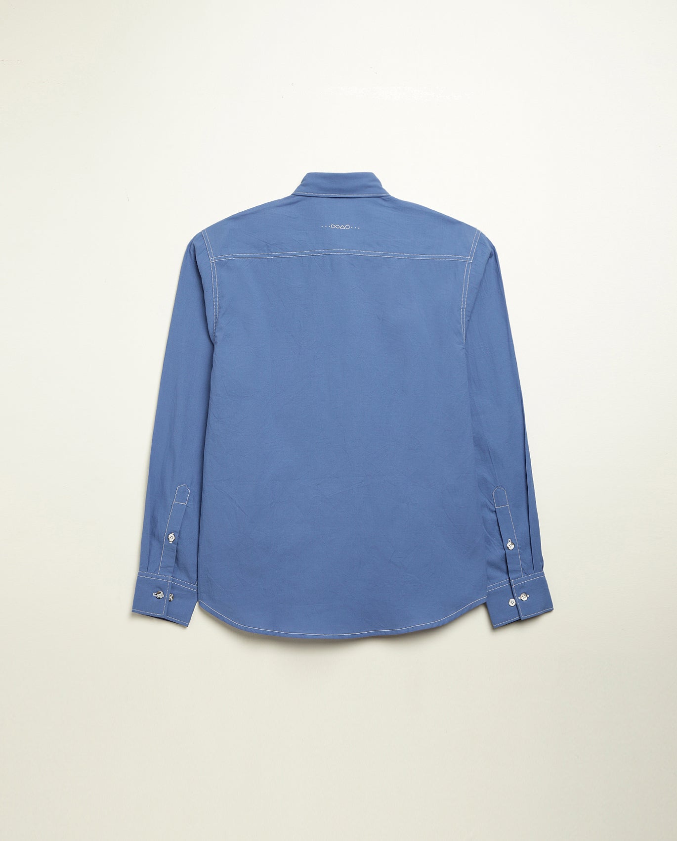 Organic cotton shirt naturally dyed in quiet blue, back view, midweight